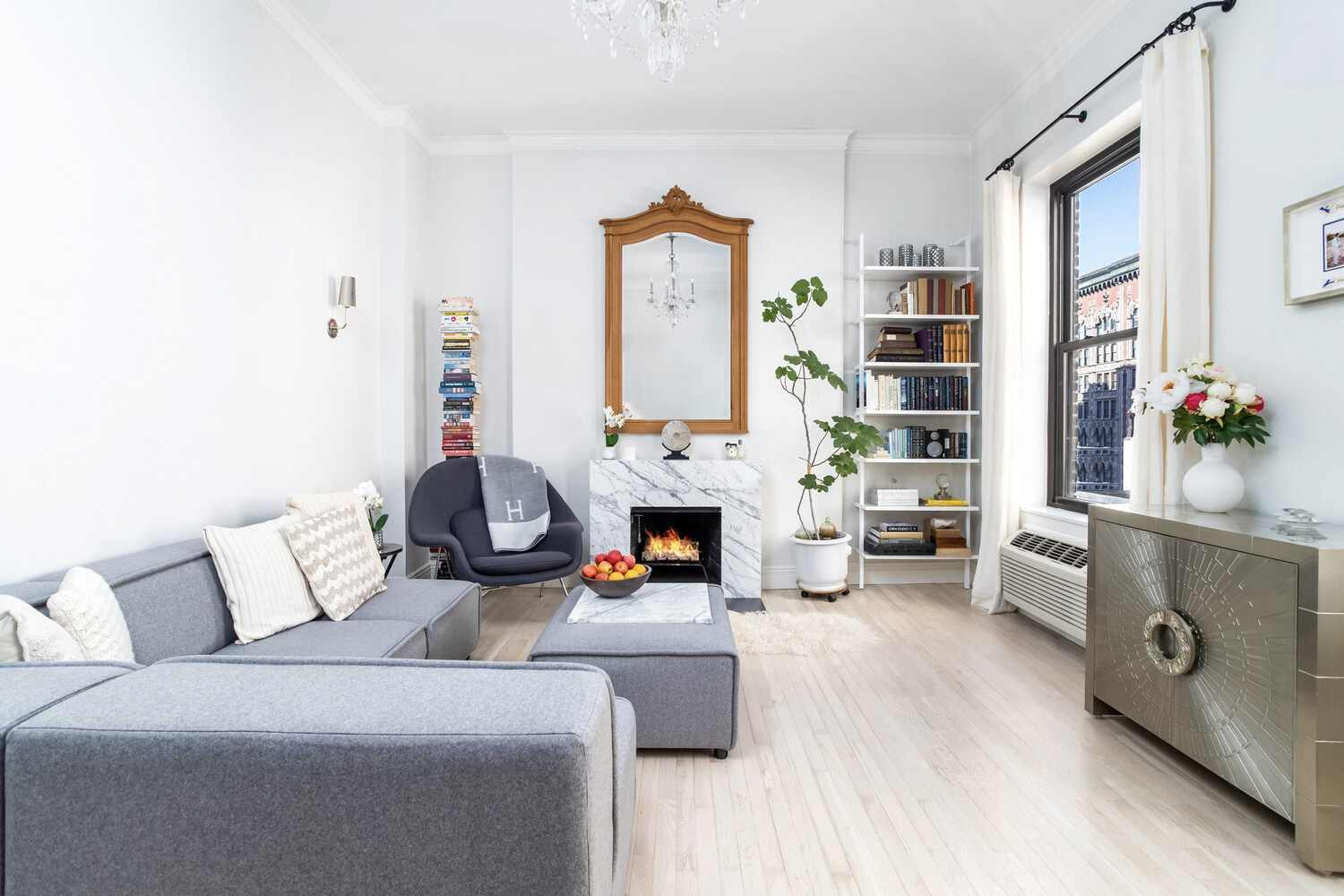 a living room with furniture and a fireplace