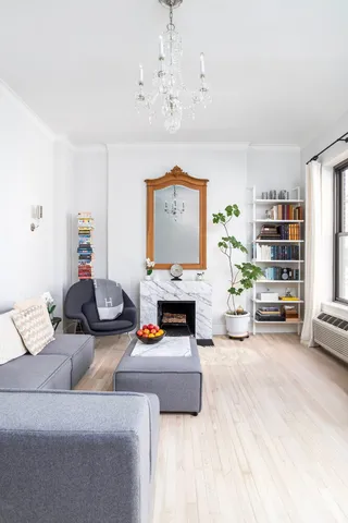 a living room with furniture and a table