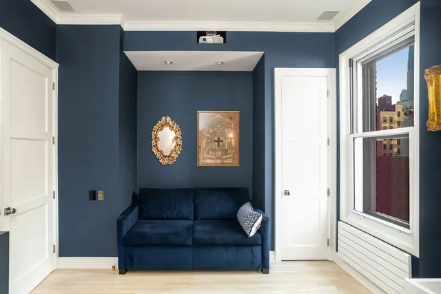 a view of room with furniture and lamp