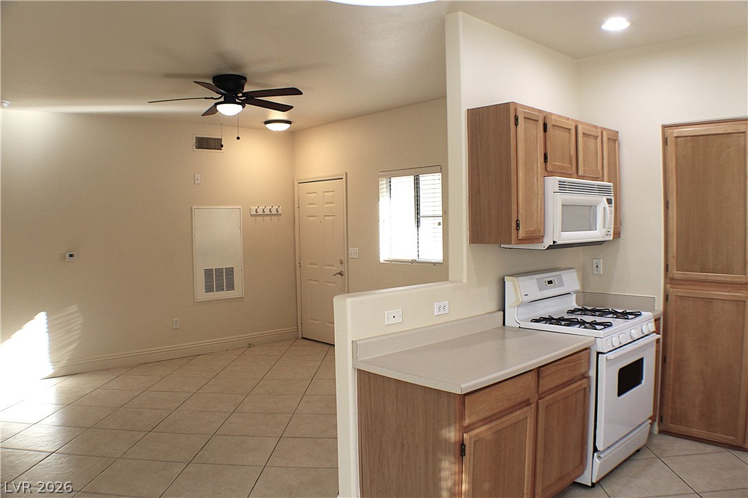 1531 Ruby Cliffs Lane, Unit 102 Las Vegas, NV 89144 - Photo 8 of 30 KITCHEN ACCENTED WITH LOW WALL FOR FAMILY ROOM VIEW!