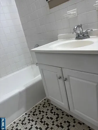 a bathroom with a sink and a bathtub