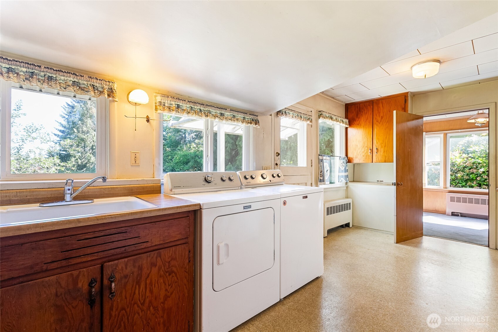 4535 Cable Street Bellingham, WA 98229 - Photo 11 of 31 a room with a sink bed and large windows