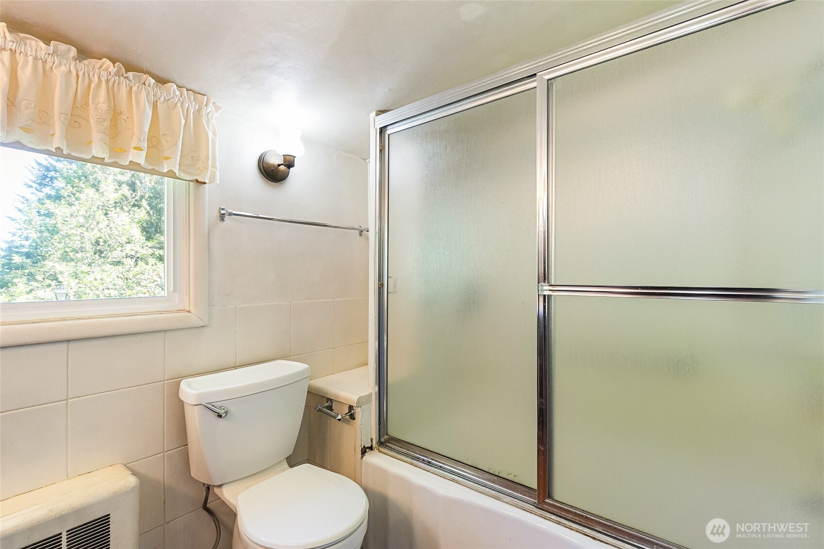 4535 Cable Street Bellingham, WA 98229 - Photo 14 of 31 a white toilet sitting next to a shower