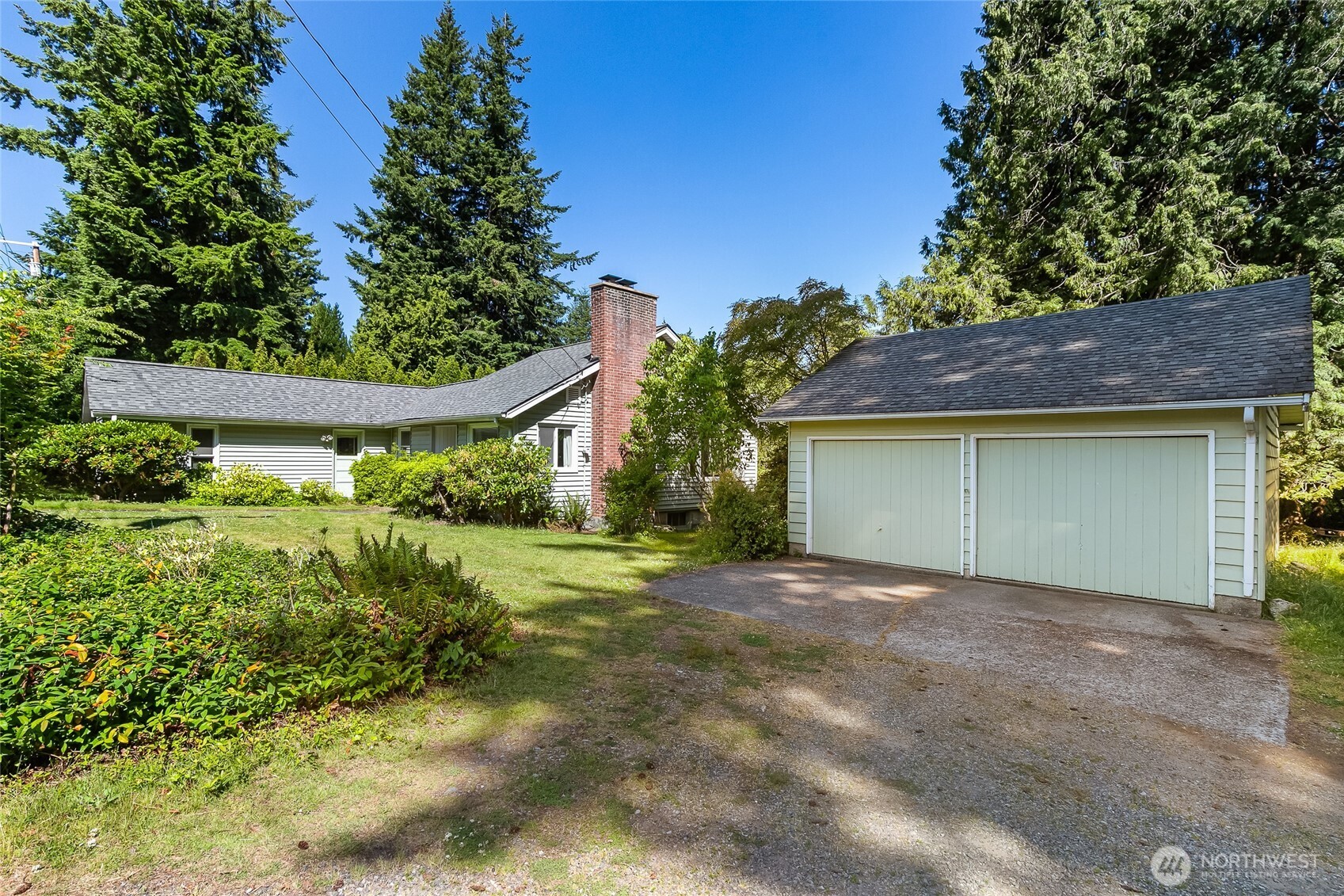 4535 Cable Street Bellingham, WA 98229 - Photo 2 of 31 a view of a house with a yard and garage