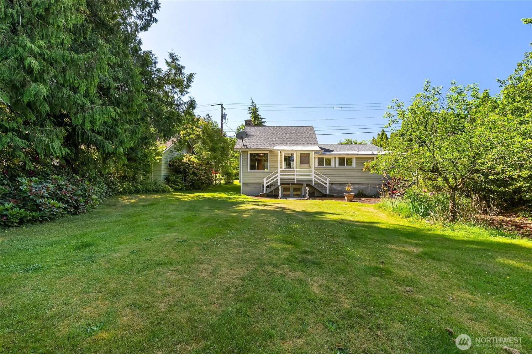 4535 Cable Street Bellingham, WA 98229 - Photo 26 of 31 a front view of a house with a big yard