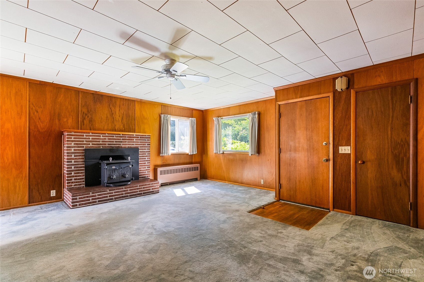 4535 Cable Street Bellingham, WA 98229 - Photo 6 of 31 an empty room with windows and fireplace