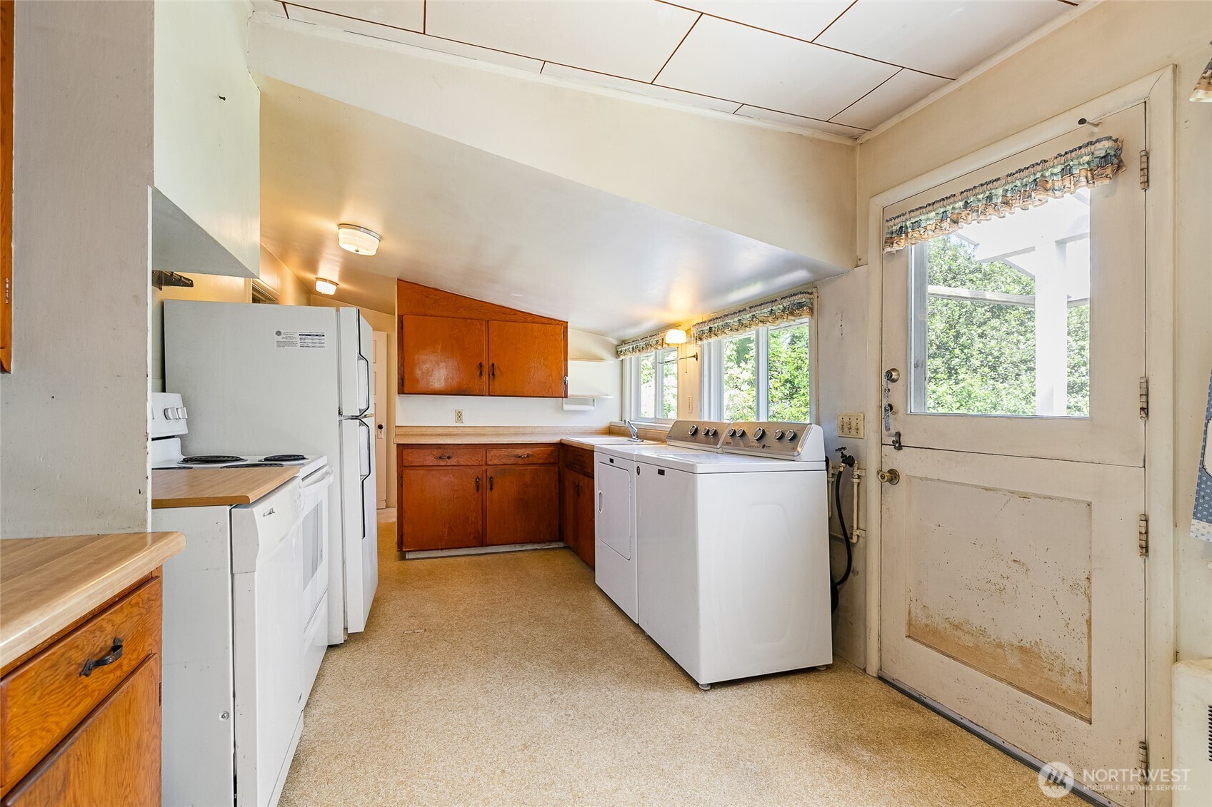 4535 Cable Street Bellingham, WA 98229 - Photo 9 of 31 a kitchen with a refrigerator and a stove
