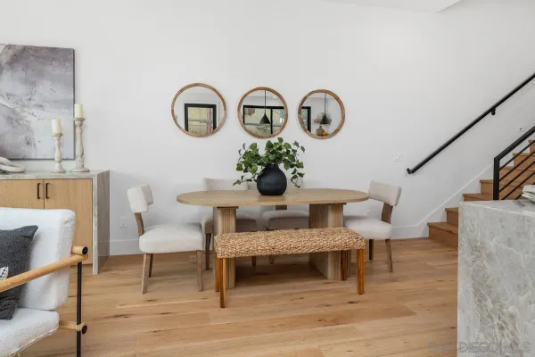 a view of a livingroom with furniture and wooden floor