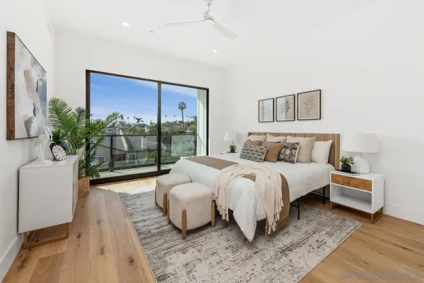 a bedroom with a large bed and a couch