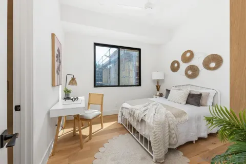 a bedroom with a bed and a table