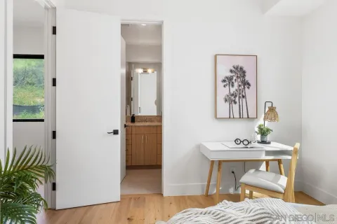 a bedroom with a bed and a table in it