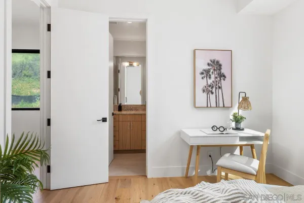 a bedroom with a bed and a table in it