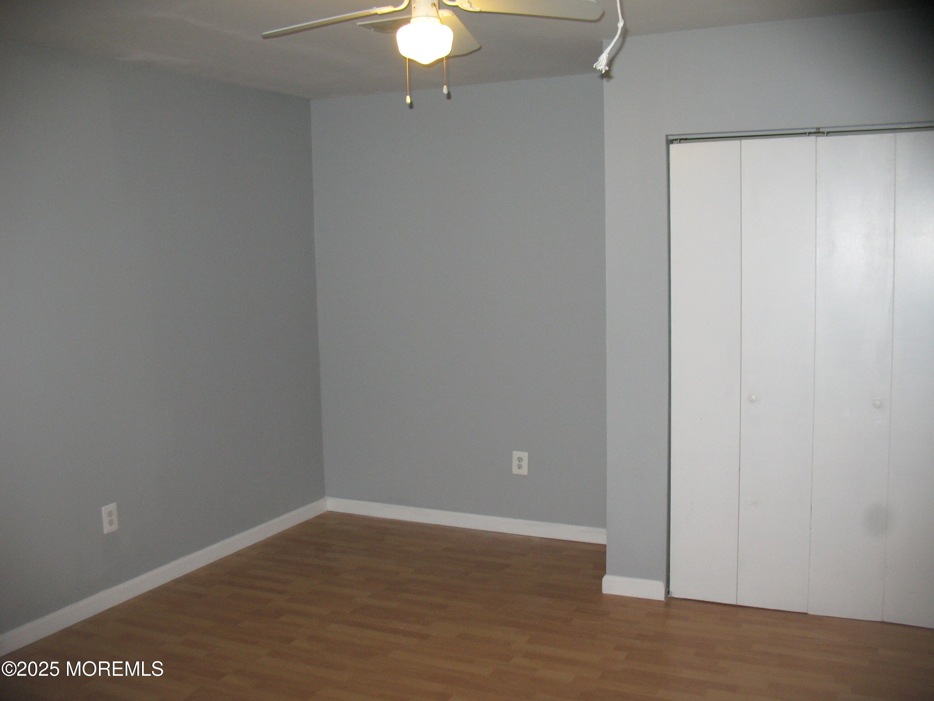 32 Appletree Road Howell, NJ 07731 - Photo 12 of 18 a view of an empty room with wooden floor