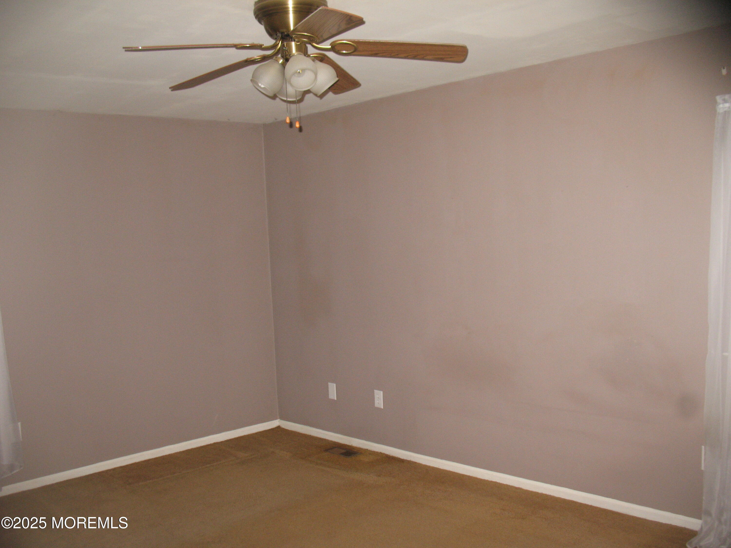 32 Appletree Road Howell, NJ 07731 - Photo 15 of 18 a view of a small space with a fan
