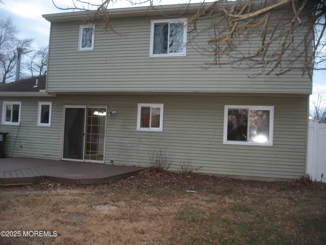 a bathroom with a granite countertop toilet and a shower