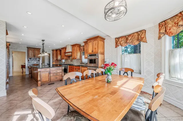 a view of a dining room with furniture window and outside view