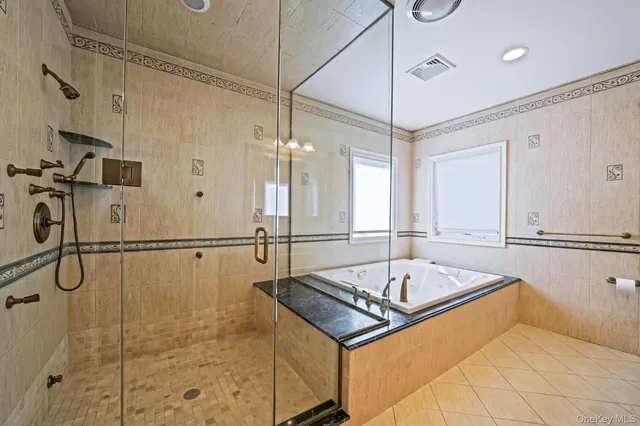 a bathroom with a granite countertop sink mirror vanity and toilet