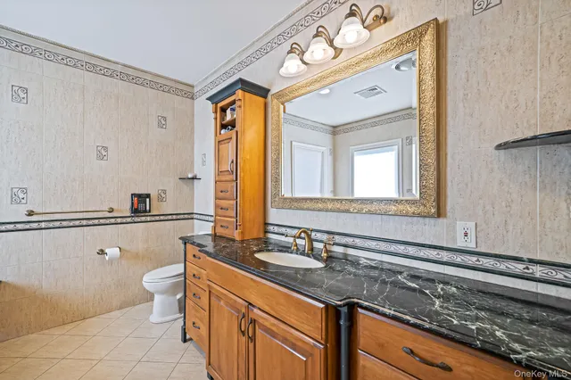 a bedroom with a bed and a book shelf