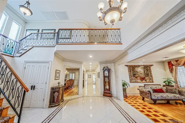 a view of a livingroom with furniture and staircase