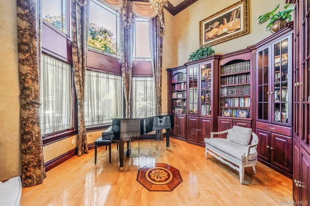 a living room with furniture and large windows