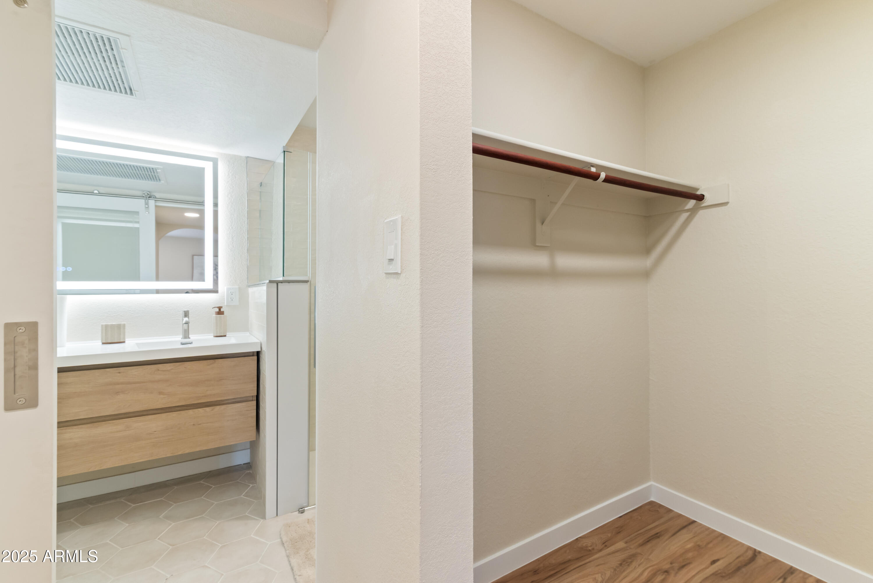 8787 East Mountain View Road, Unit 2101 Scottsdale, AZ 85258 - Photo 16 of 39 a bathroom with a sink and a mirror