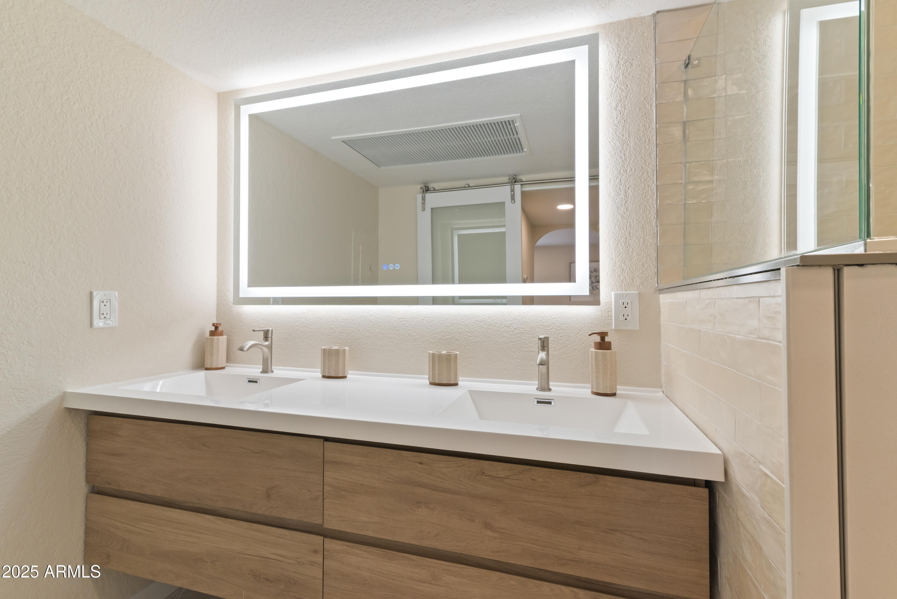 8787 East Mountain View Road, Unit 2101 Scottsdale, AZ 85258 - Photo 17 of 39 a bathroom with a sink and a mirror
