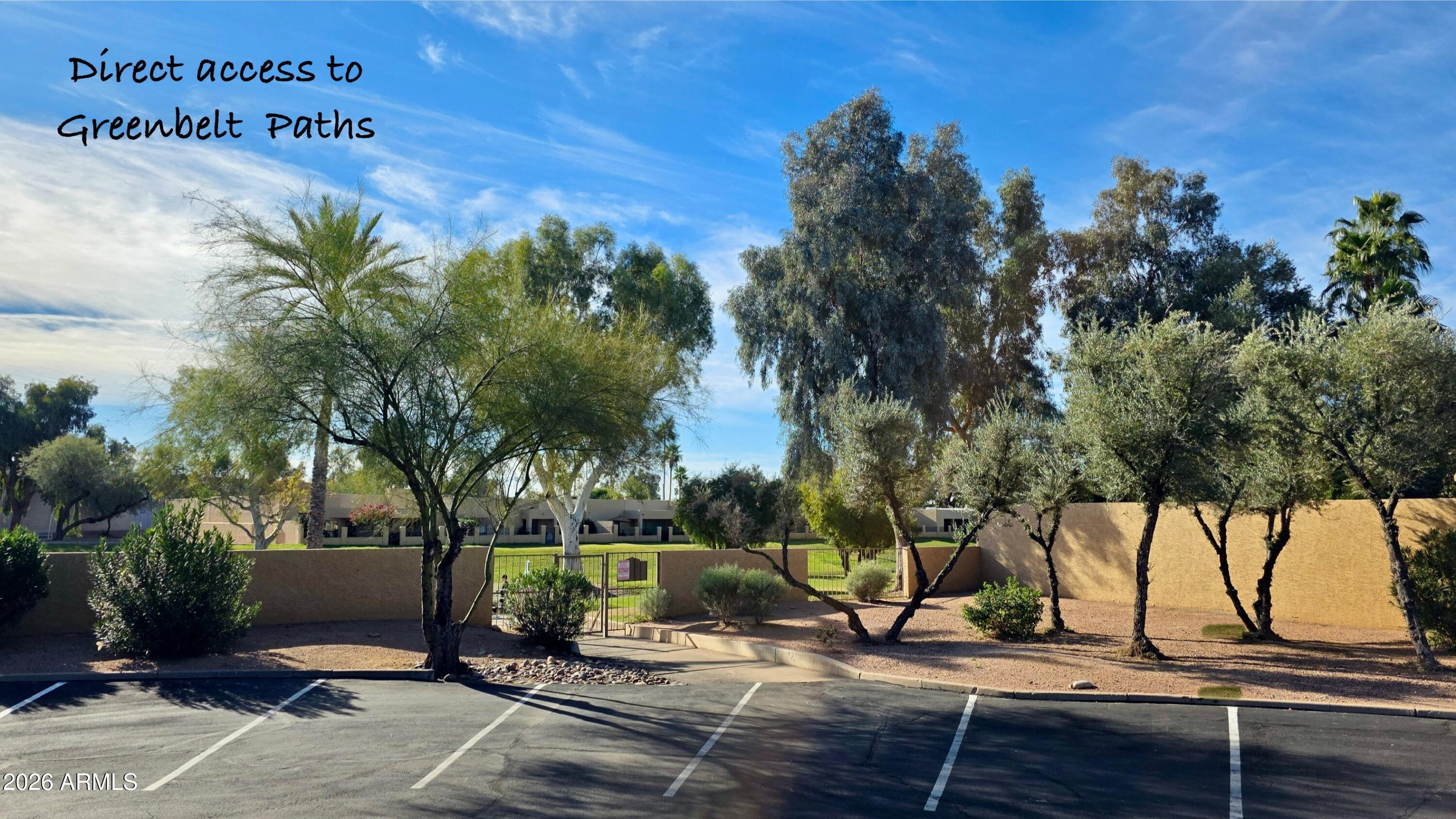 8787 East Mountain View Road, Unit 2101 Scottsdale, AZ 85258 - Photo 29 of 39 a view of a park with plants and a bench