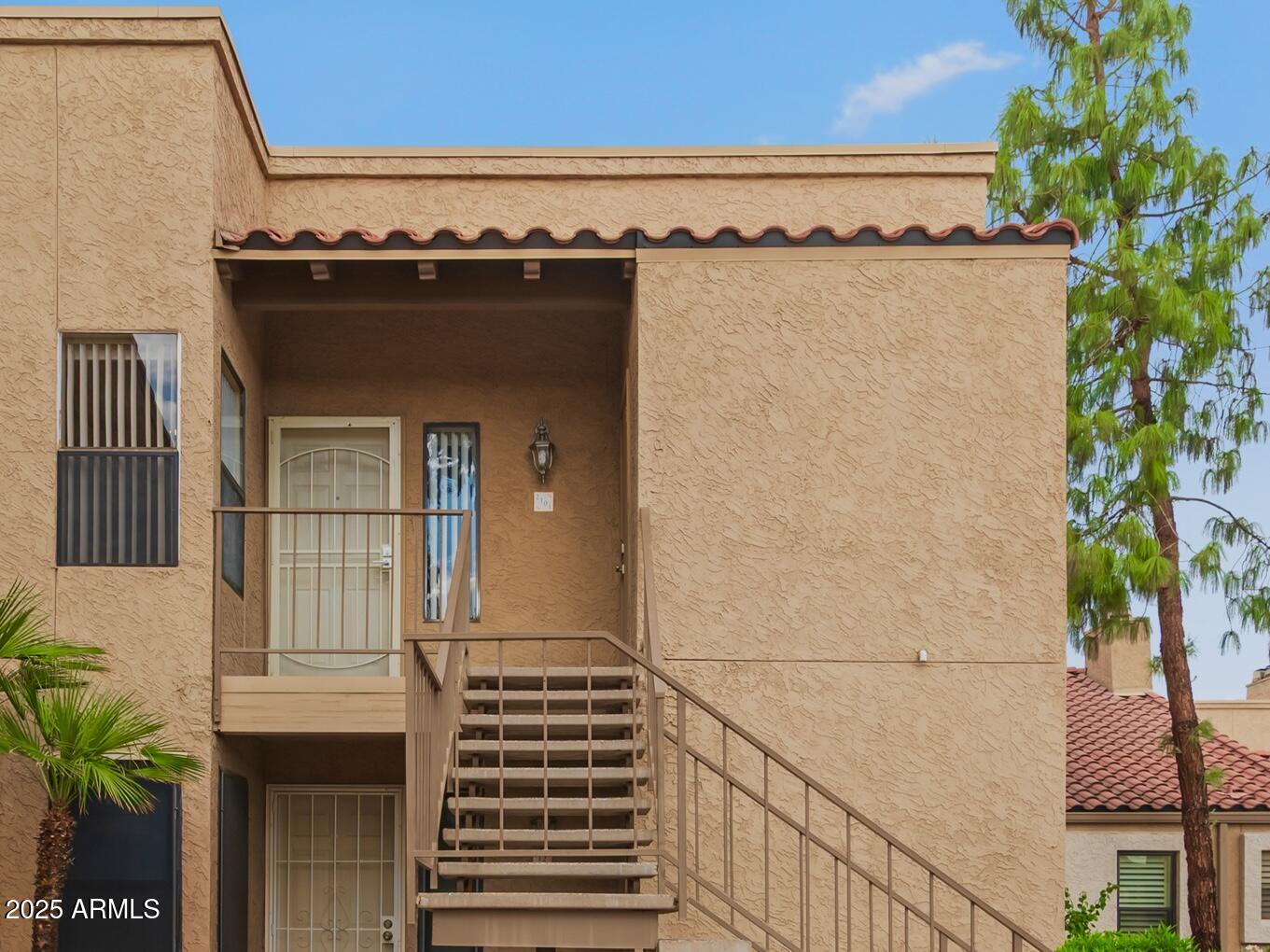 8787 East Mountain View Road, Unit 2101 Scottsdale, AZ 85258 - Photo 2 of 39 a view of a balcony with table and chairs