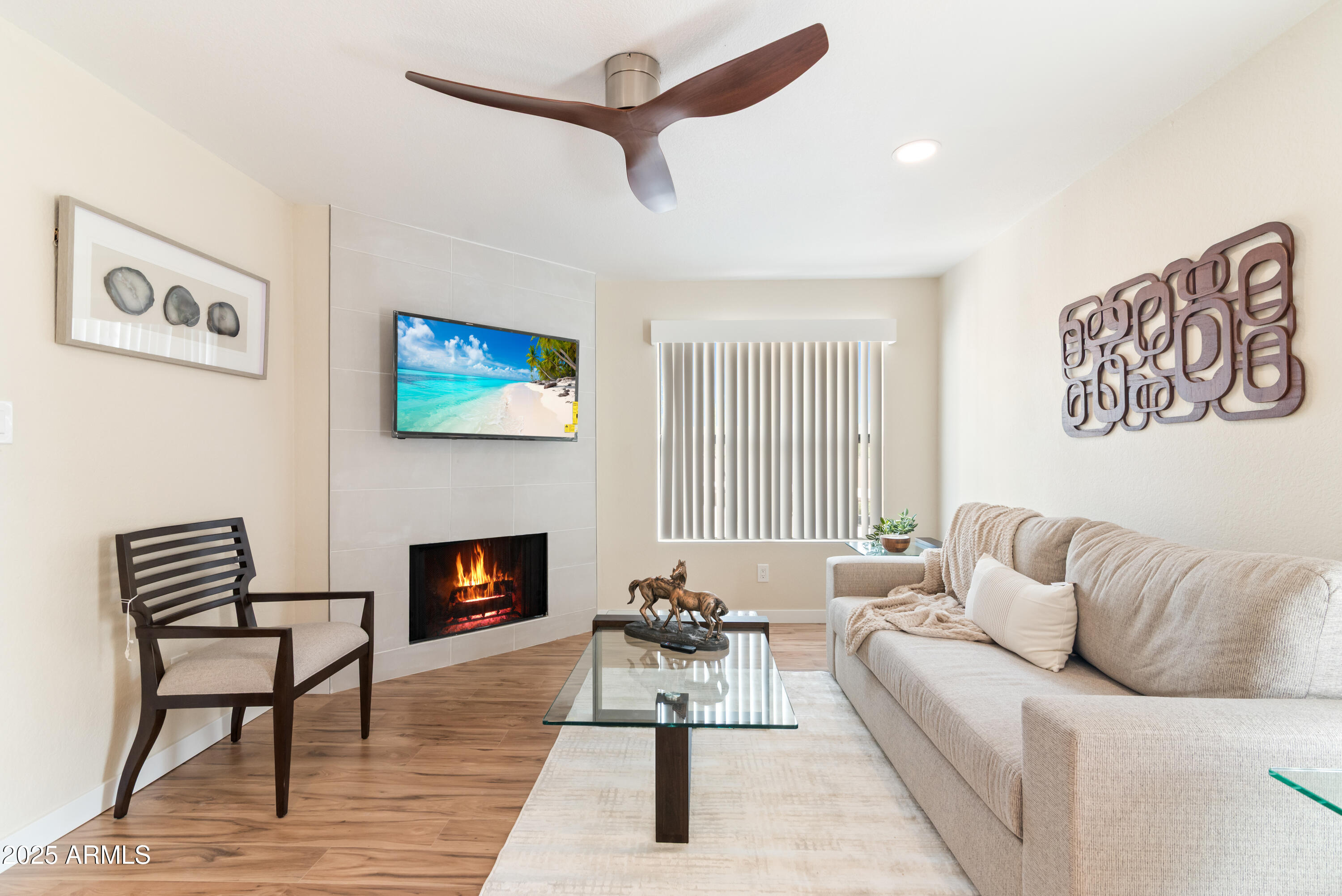 8787 East Mountain View Road, Unit 2101 Scottsdale, AZ 85258 - Photo 9 of 39 a living room with furniture and a fireplace