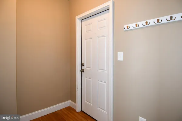 a bedroom with furniture and wooden floor