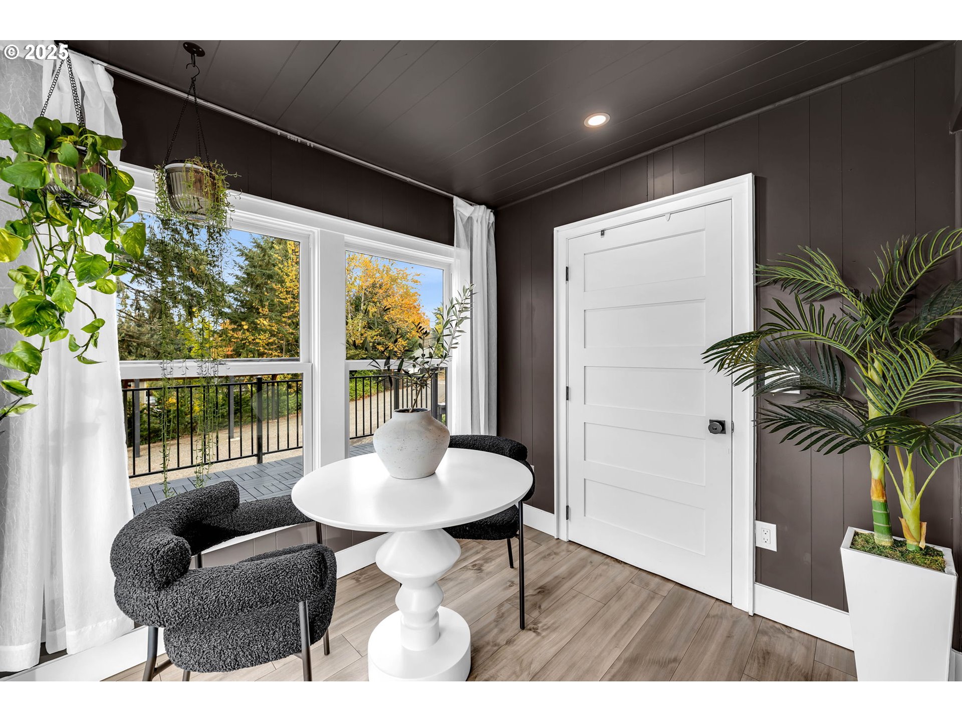 205 South Hillhurst Road Ridgefield, WA 98642 - Photo 25 of 43 a living room with furniture and a potted plant