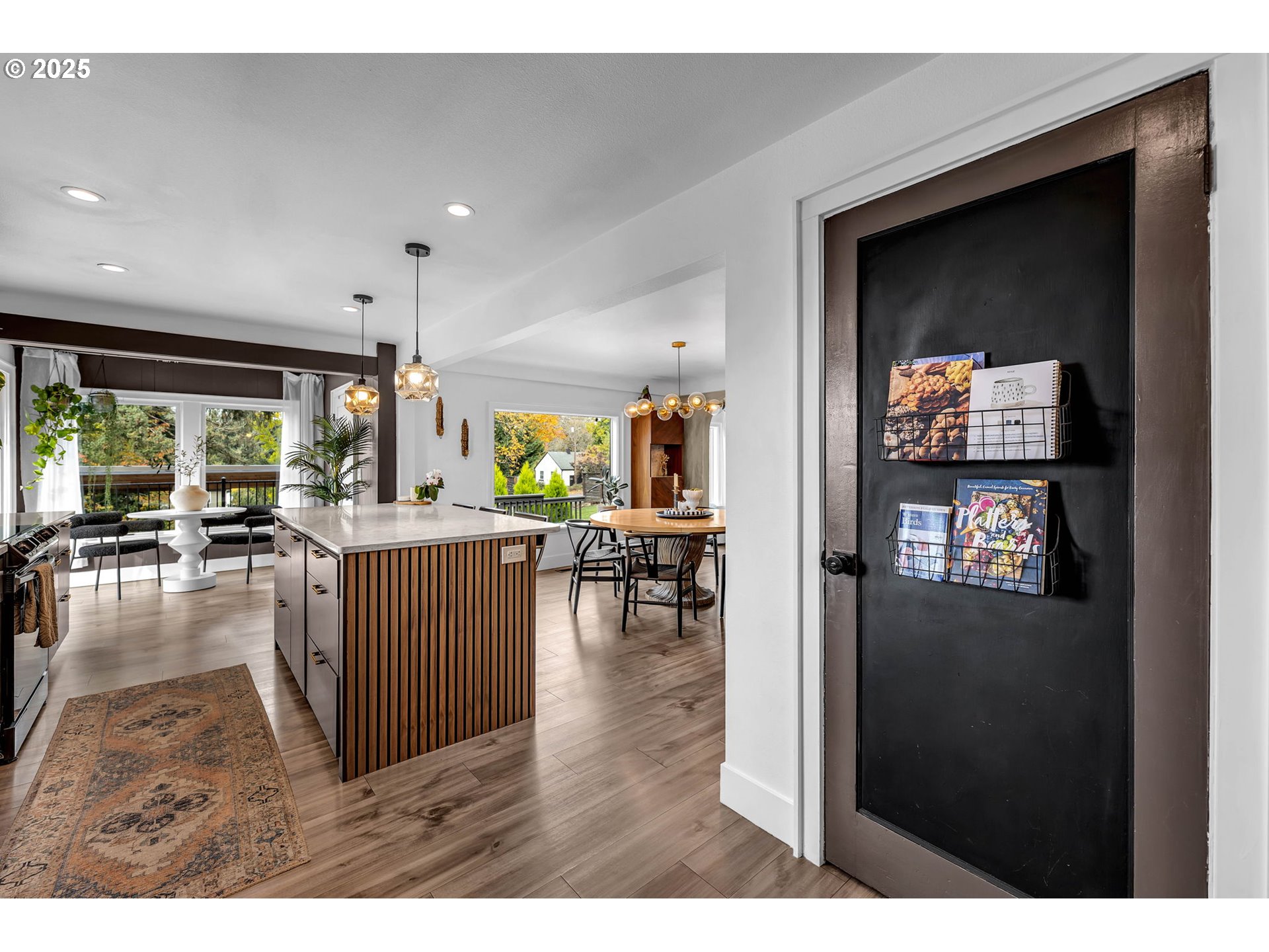 205 South Hillhurst Road Ridgefield, WA 98642 - Photo 29 of 43 a living room with furniture and a wooden floor