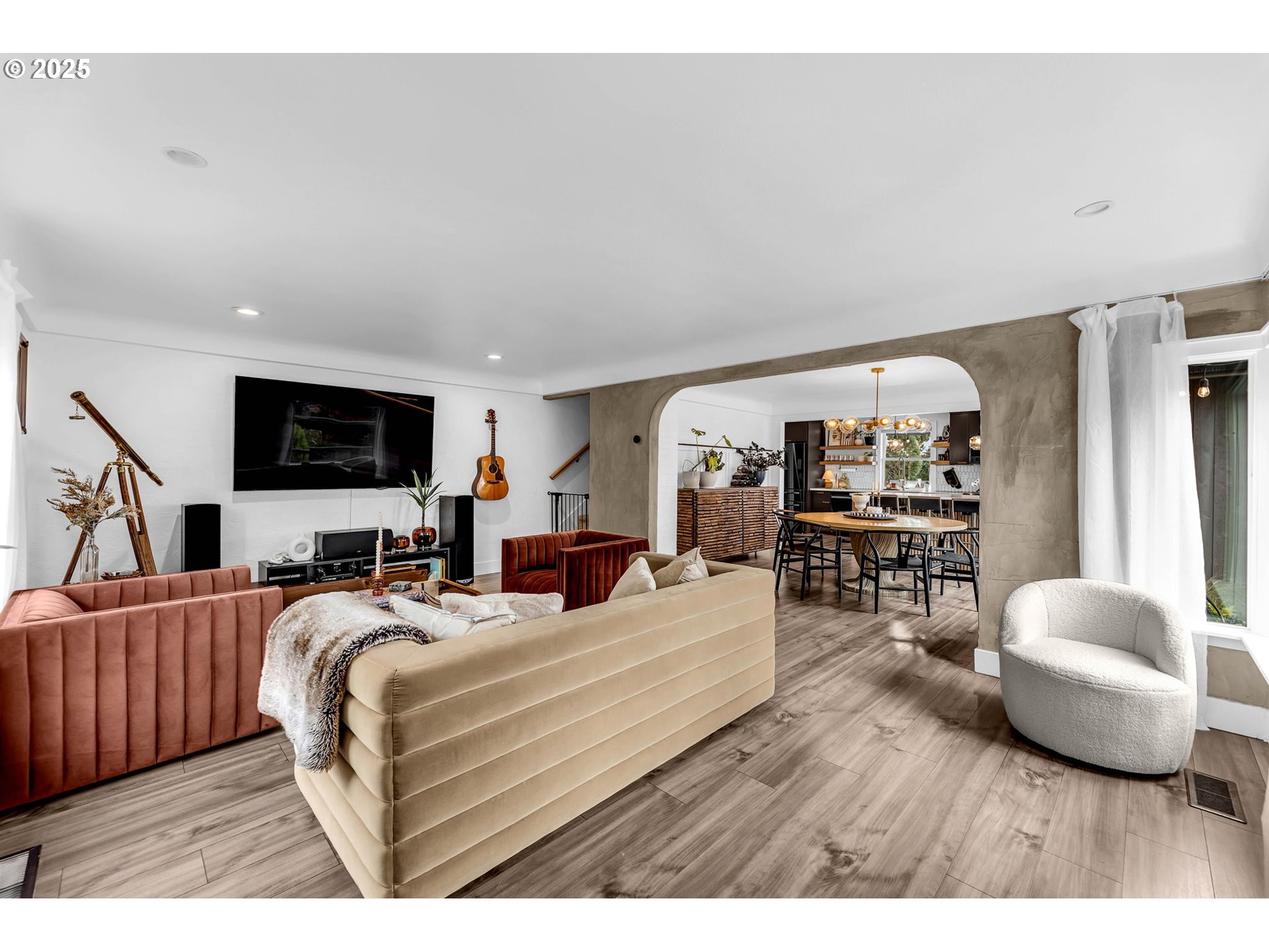 205 South Hillhurst Road Ridgefield, WA 98642 - Photo 10 of 43 a living room with furniture a flat screen tv and a large window
