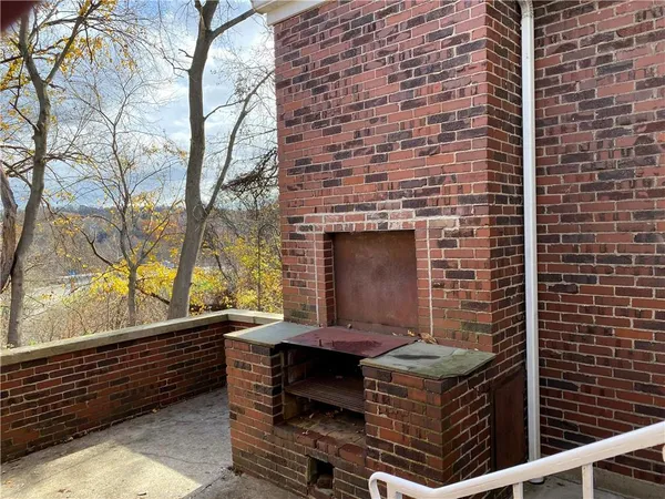a brick building with a bench in front of it