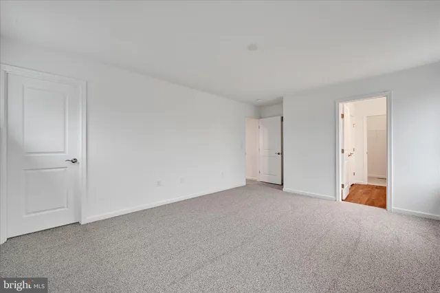 a view of an empty room and entryway