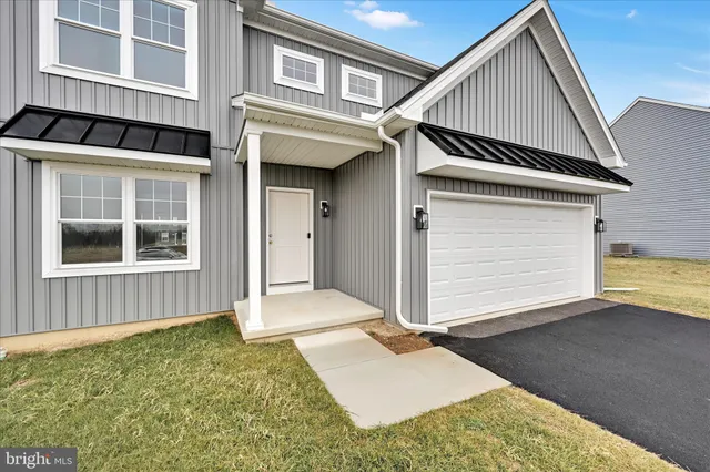 a front view of a house with a garage