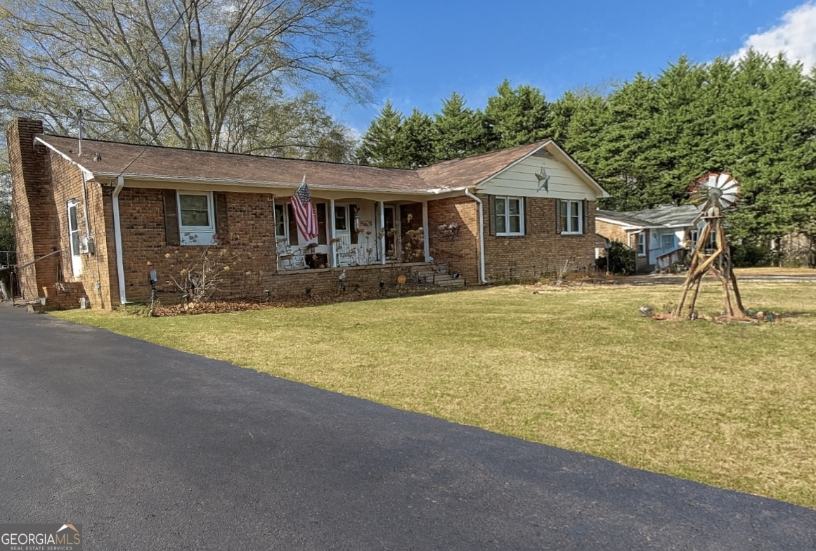 326 Remsdale Road Toccoa, GA 30577 - Photo 1 of 33 a front view of a house with a yard