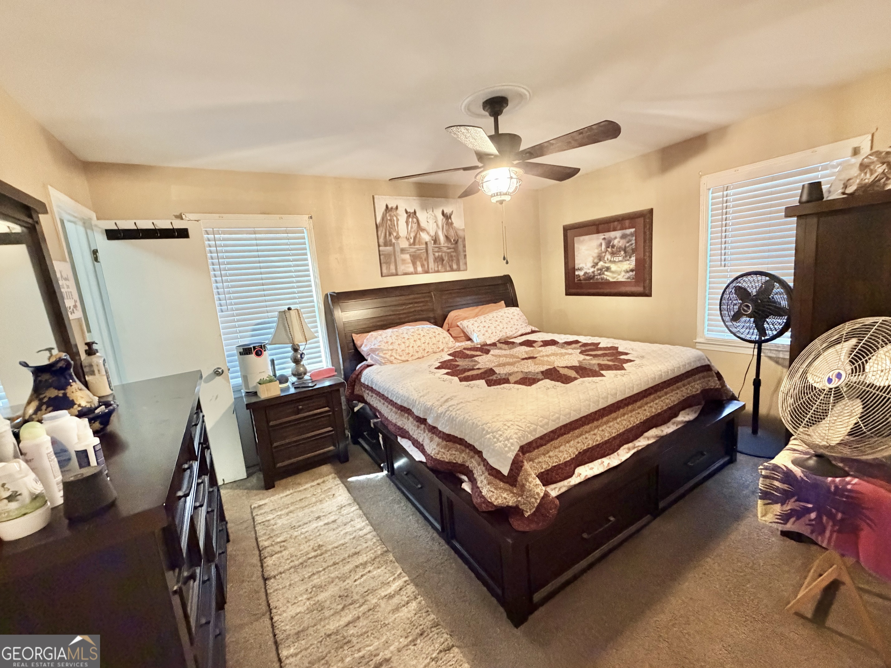 326 Remsdale Road Toccoa, GA 30577 - Photo 11 of 33 a bedroom with a bed and a chandelier