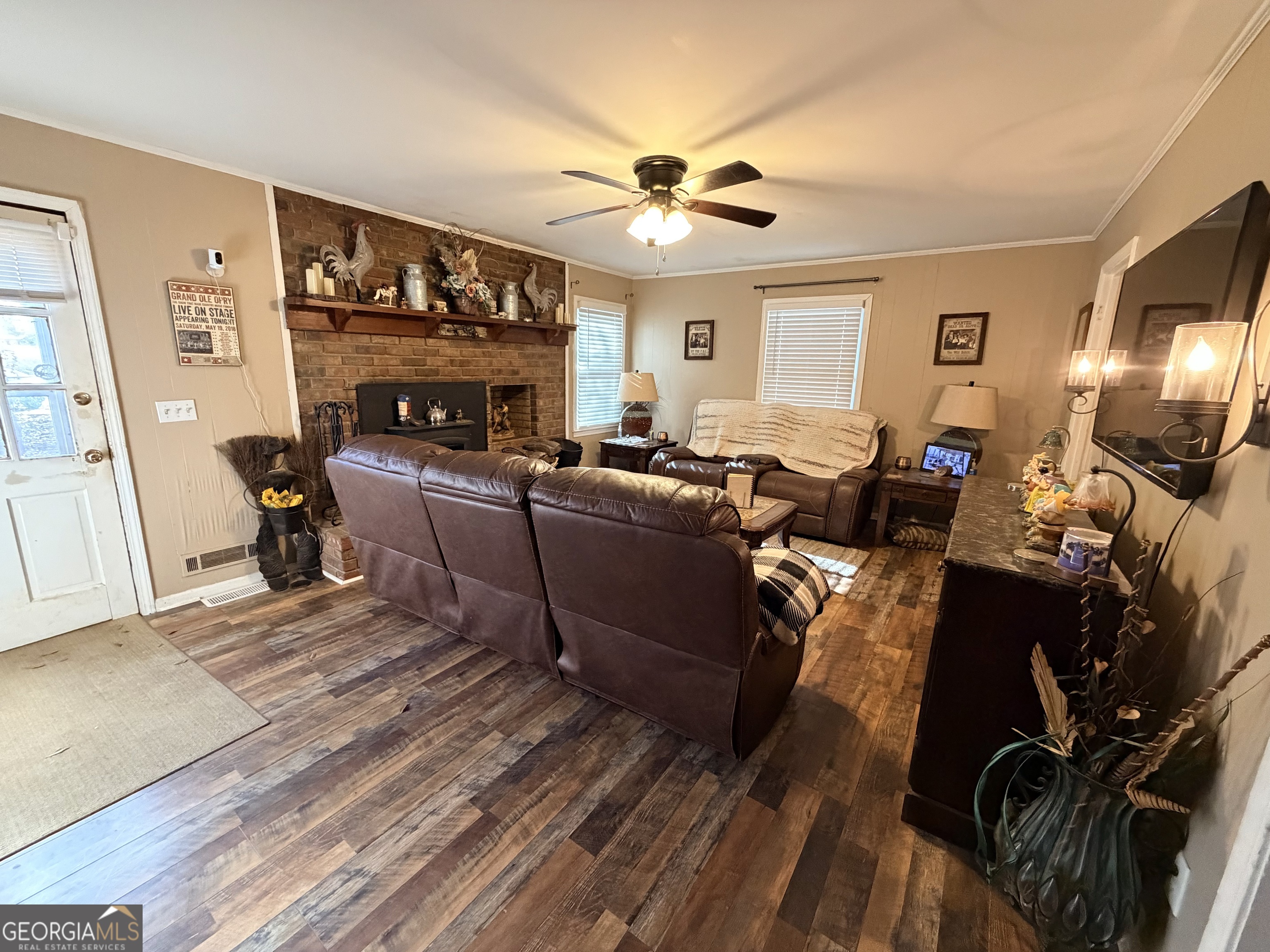 326 Remsdale Road Toccoa, GA 30577 - Photo 4 of 33 a living room with furniture a fireplace and a flat screen tv