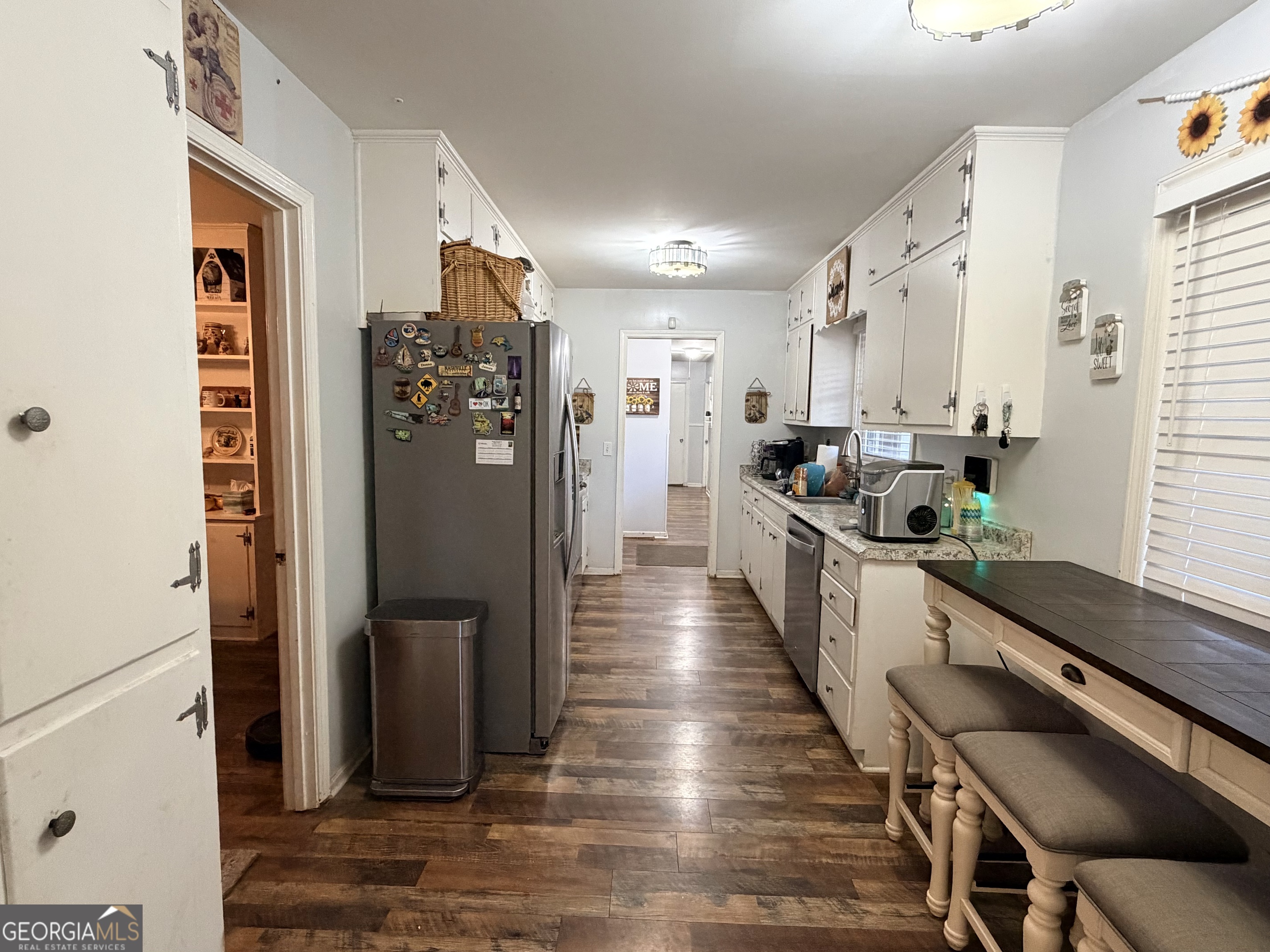 326 Remsdale Road Toccoa, GA 30577 - Photo 5 of 33 a large kitchen with a large window and stainless steel appliances