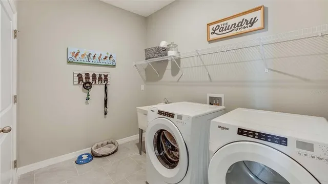 a utility room with dryer and washer