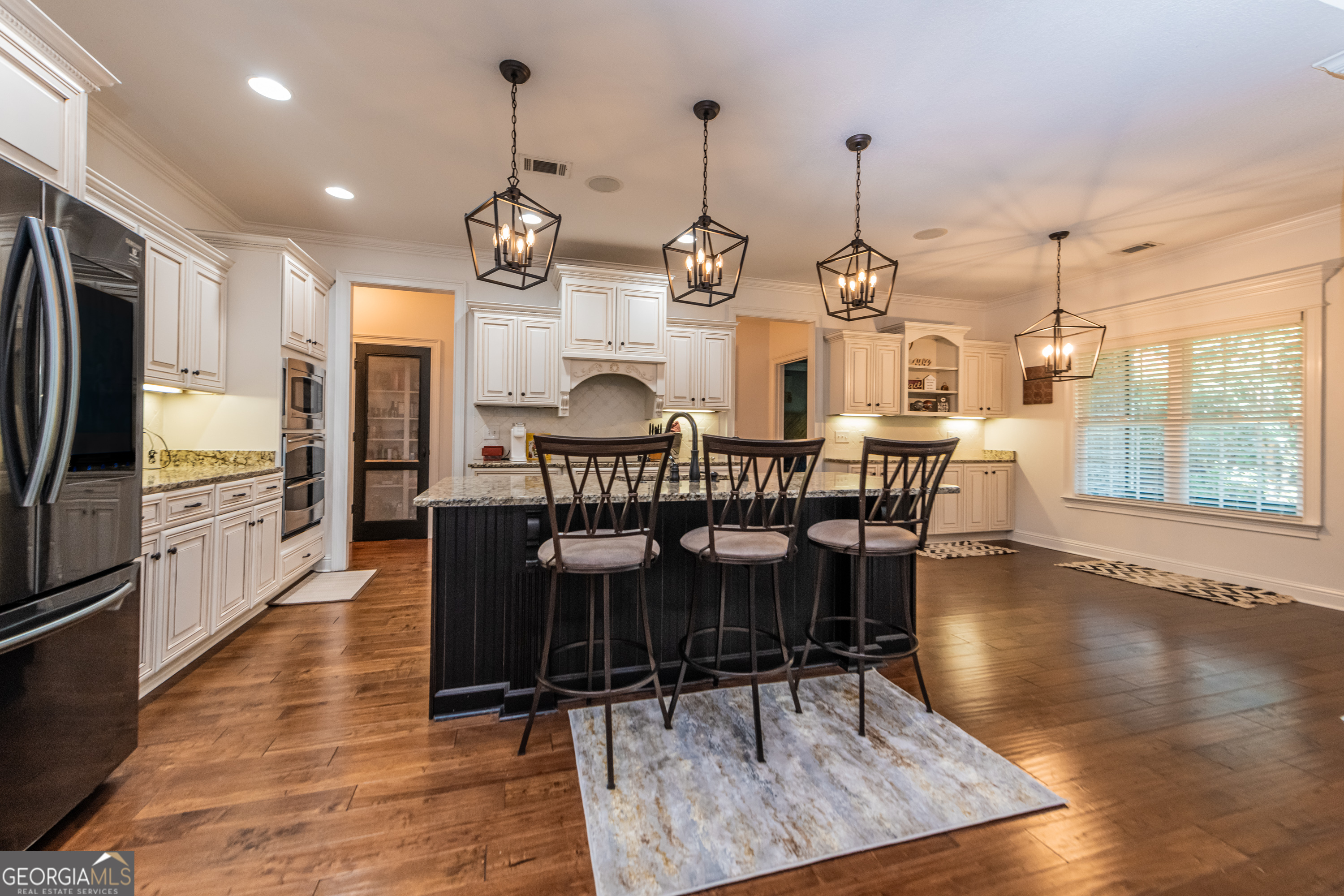 405 Old Bridge Road Warner Robins, GA 31088 - Photo 15 of 55 a view of a dining room with furniture window and wooden floor