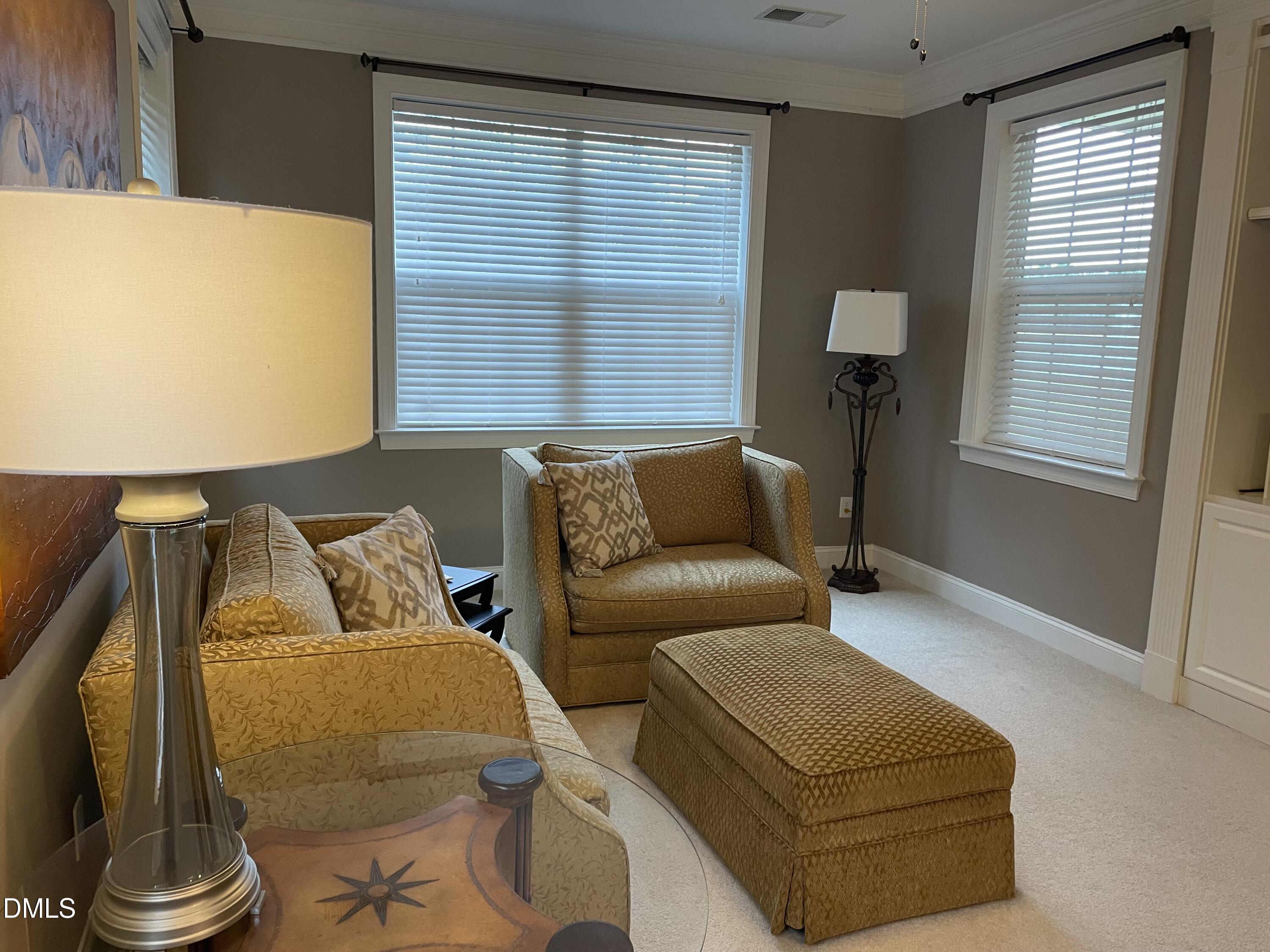 10411 Rosegate Court, Unit 3 Raleigh, NC 27617 - Photo 8 of 62 a living room with furniture and a window