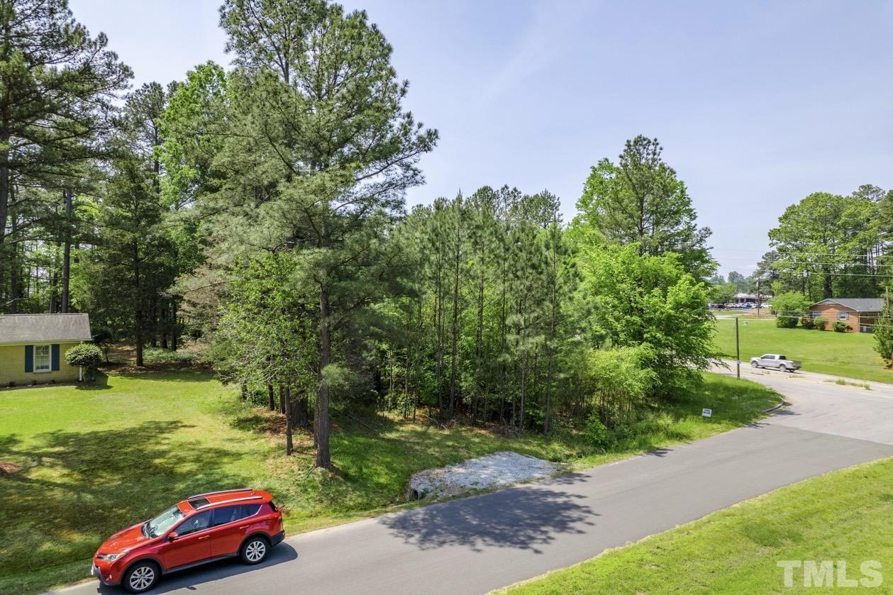 102 Mickey Circle Durham, NC 27712 - Photo 5 of 16 a yard with lots of green space and car parked