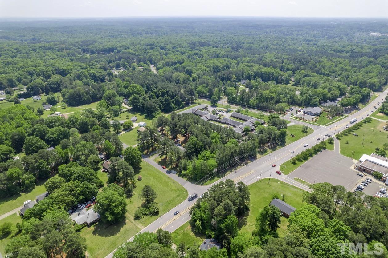 102 Mickey Circle Durham, NC 27712 - Photo 10 of 16 an aerial view of a house with a yard and lake view
