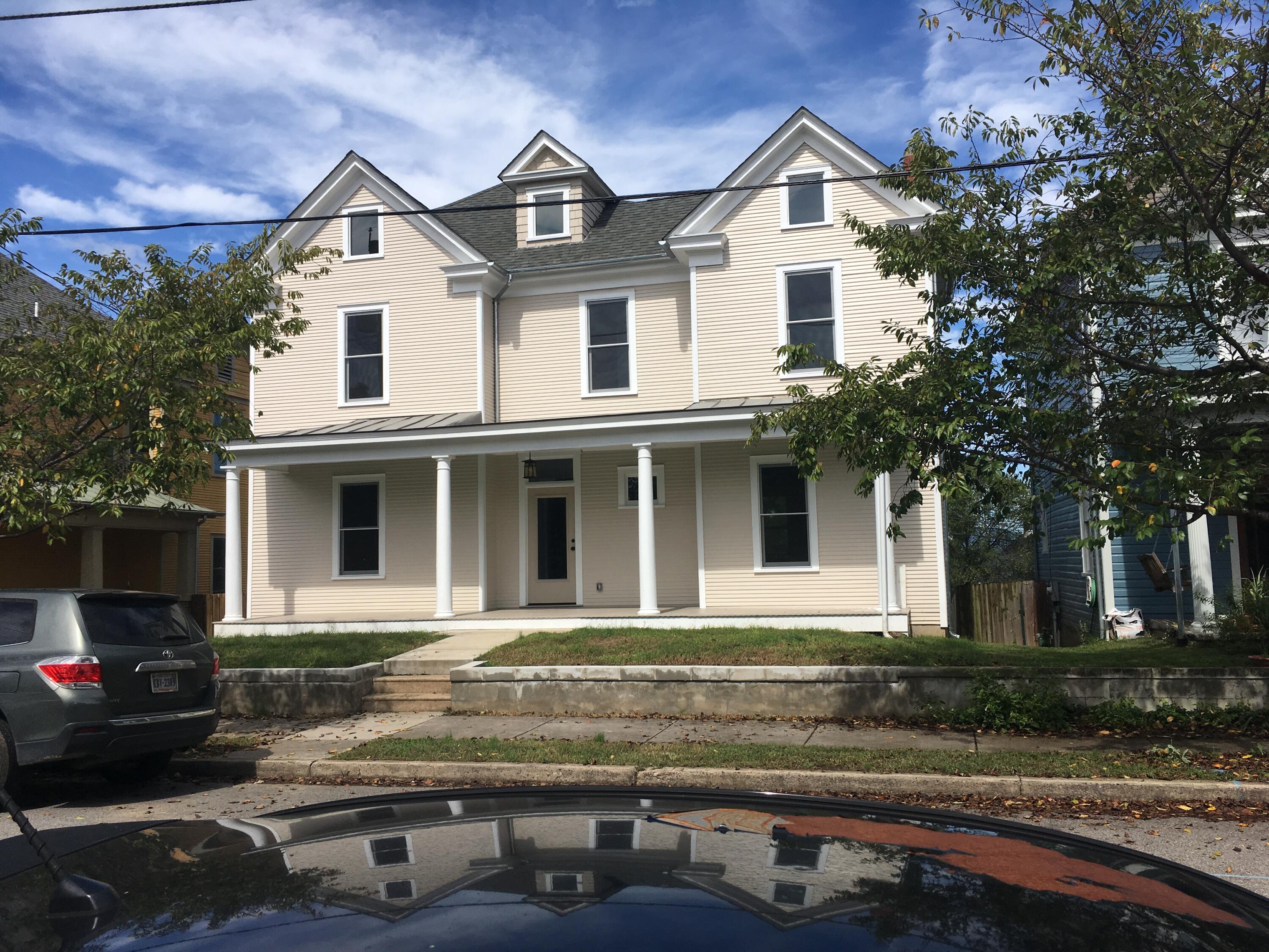 a front view of a house with yard