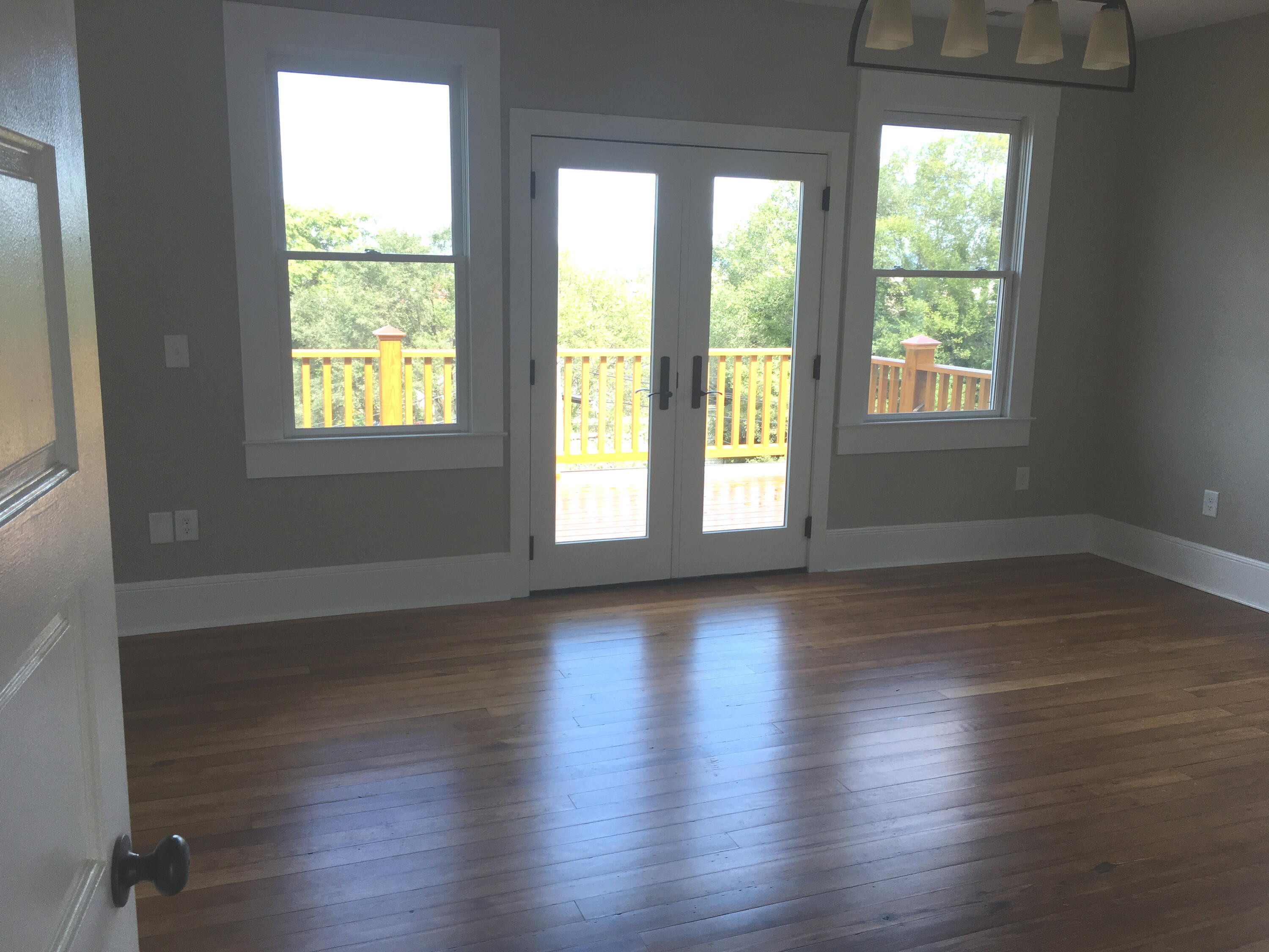 415 Day Avenue Southwest Roanoke, VA 24016 - Photo 2 of 15 an empty room with wooden floor and windows
