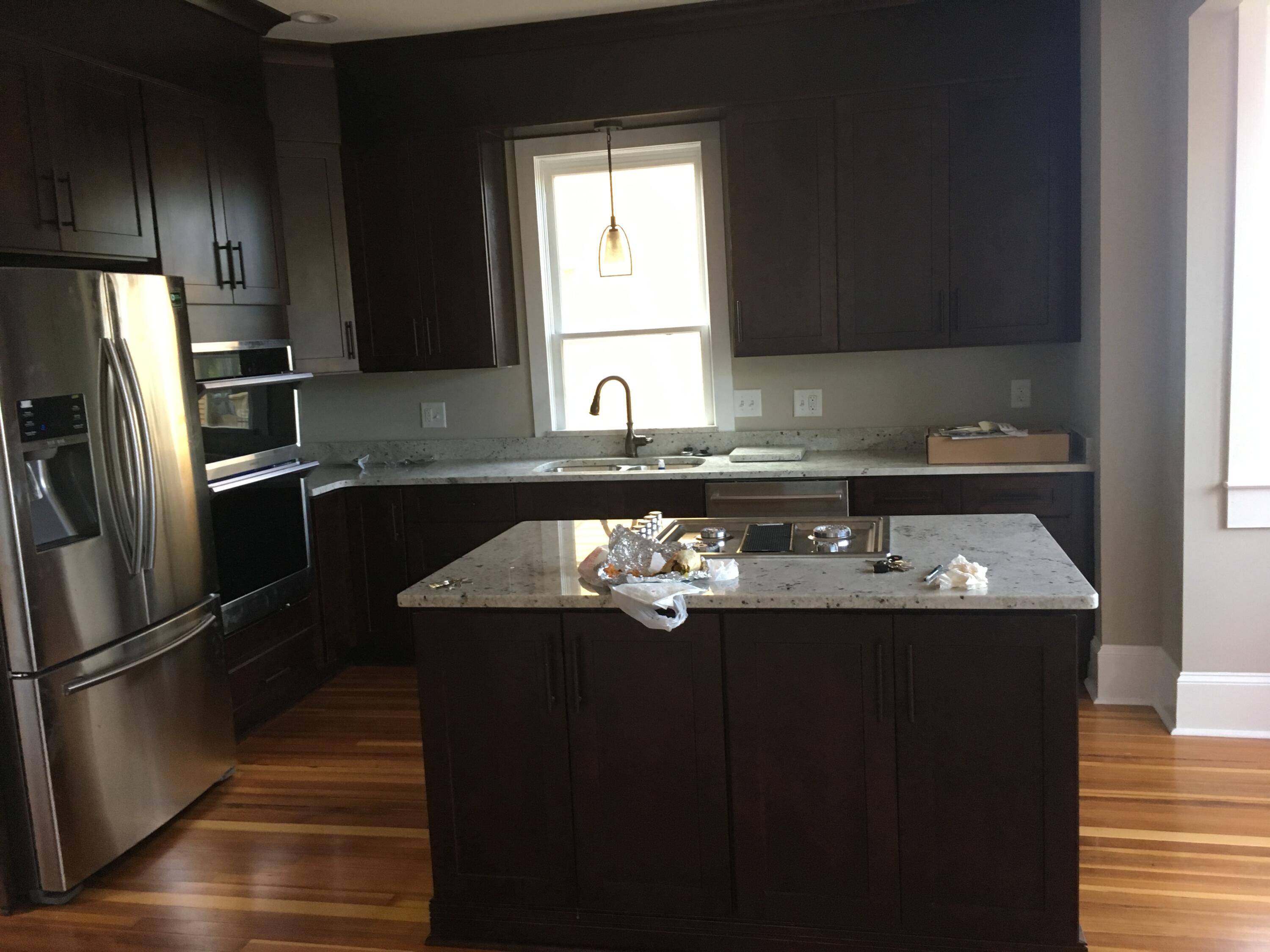 415 Day Avenue Southwest Roanoke, VA 24016 - Photo 4 of 15 a kitchen with kitchen island stainless steel appliances a sink stove and refrigerator