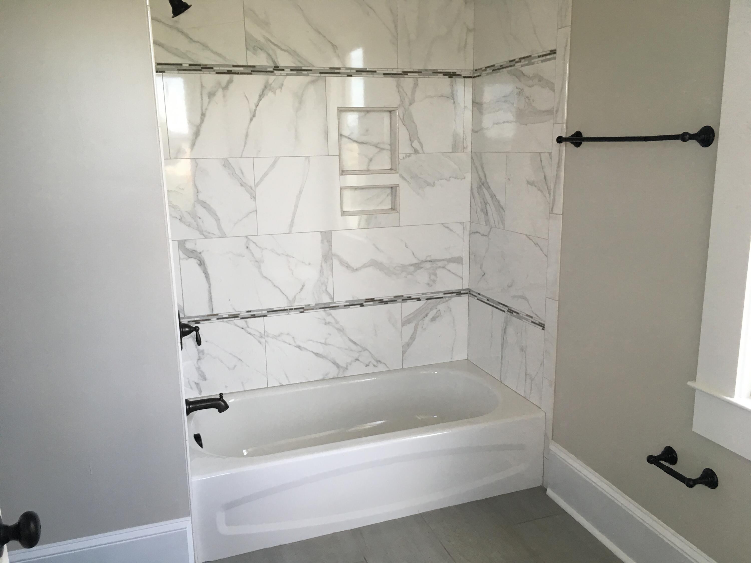 415 Day Avenue Southwest Roanoke, VA 24016 - Photo 9 of 15 a bathroom with a bathtub and a shower