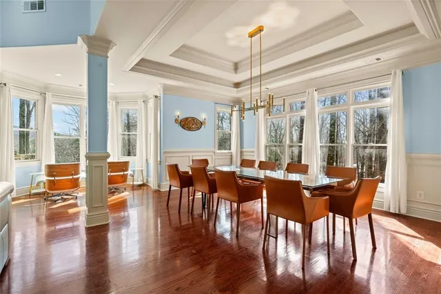a view of a dining room with furniture window and wooden floor
